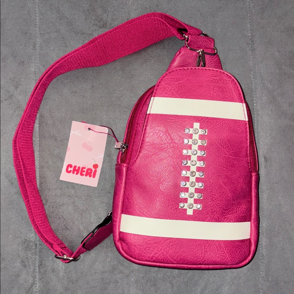 🏈 Sale! Cheri Pink Football Sling Backpack Purse. New with tags!